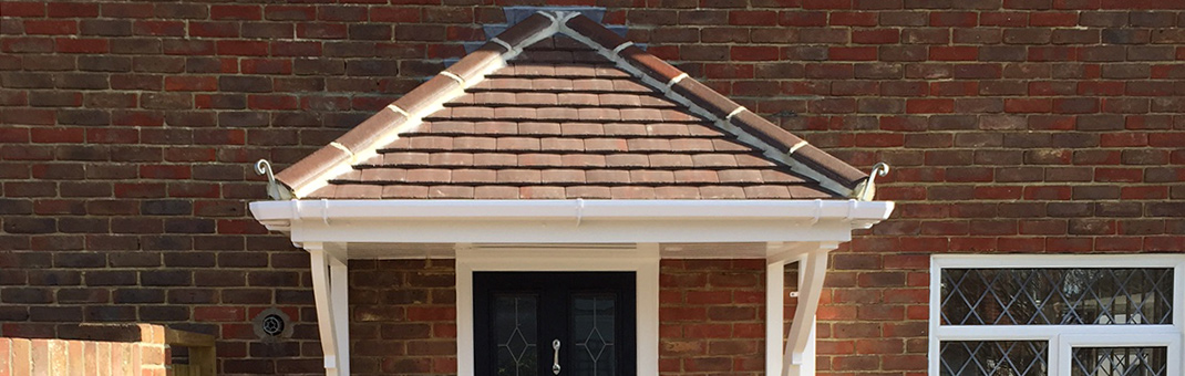 Timber door canopy with tiled roof