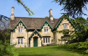 stone cottage in Somerset, England with ornate green barge boards