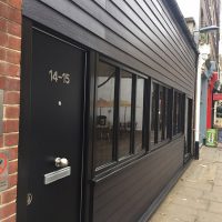 Black James Hardie cladding installation in London