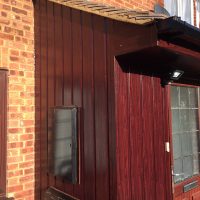 Replacement timber cladding on porch