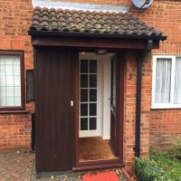 Old porch roof with incorrect pitch and rotten timber