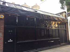 Property before cladding and new roof