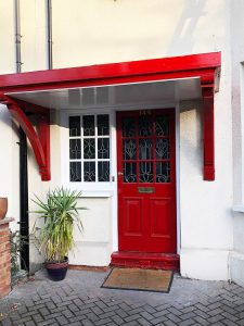 Red door canopy in Muswell Hill