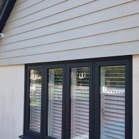 Concrete cladding above window