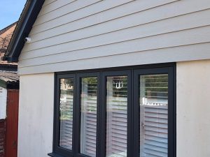 Concrete cladding above window