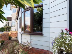 Concrete cladding around bay window