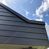 Grey timber effect weatherproof cladding