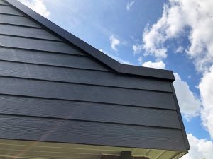 Grey timber effect weatherproof cladding