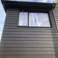 Black James Hardie cladding around window