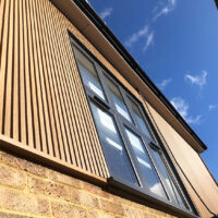 Ecoscape spiced oak cladding in surrey