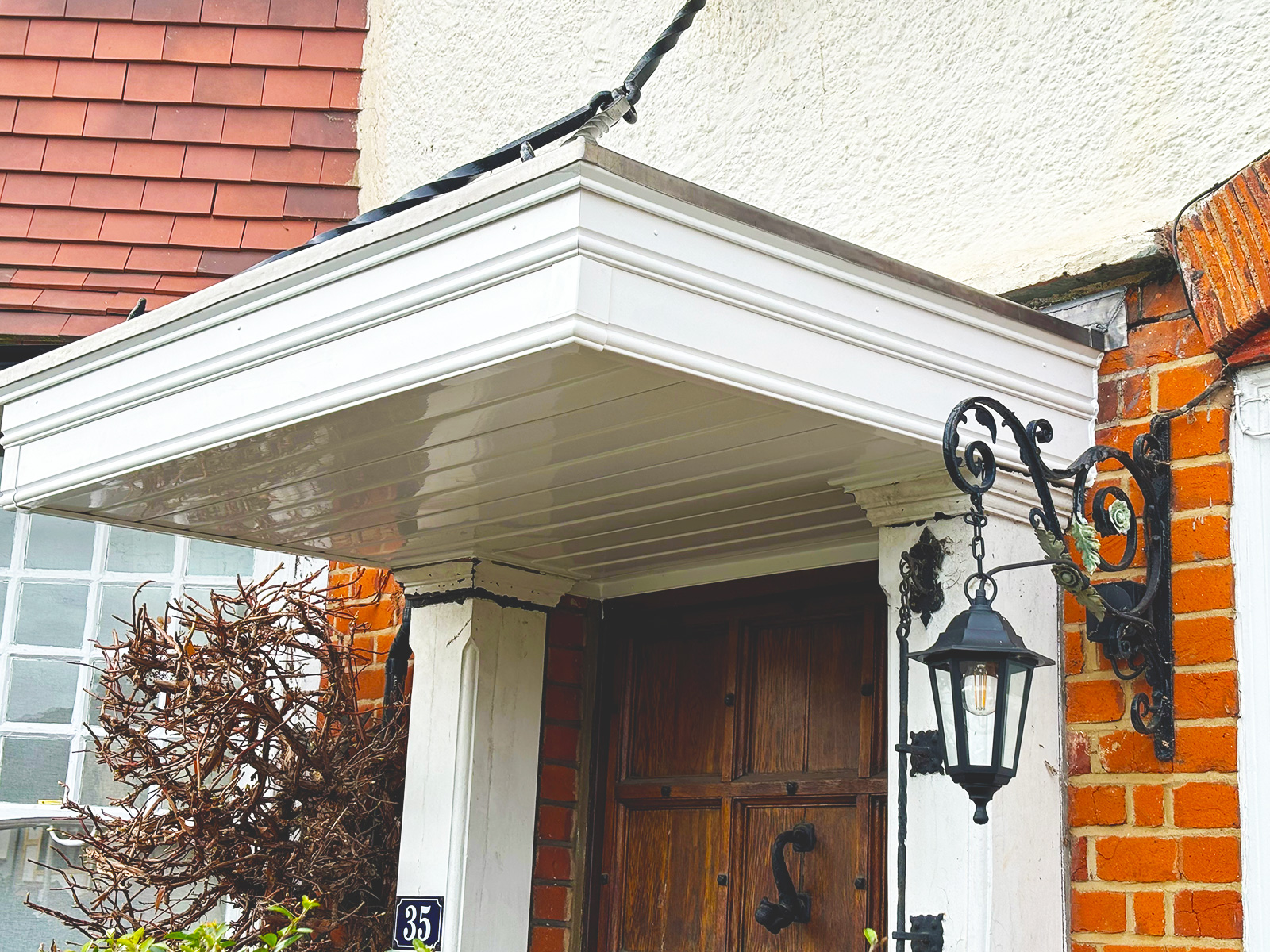 Door canopy installation in Woodford Green