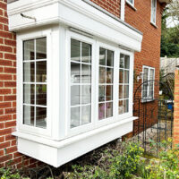 Ornate white fascias over a bay window