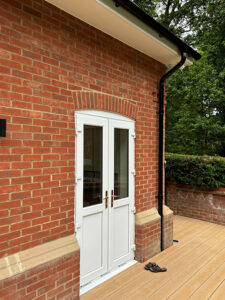 Black Lindab steel guttering and downpipes