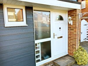 Newly installed grey cladding by front door