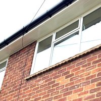 Replacement soffits and guttering over window