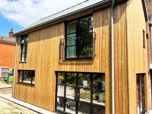 Cedar cladding installation with brunnea treatment