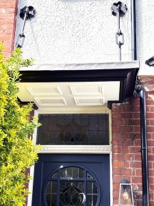 Bespoke door canopy with metal supporting straps