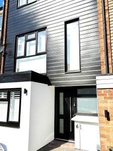 Black PVC Shiplap cladding installation in Loughton, Essex
