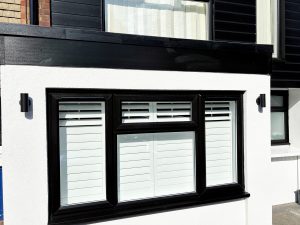 Black fascia boards installed with matching black PVC cladding
