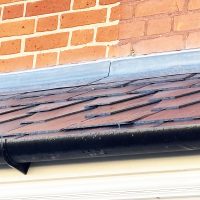 Traditional Welsh slate roof on door canopy