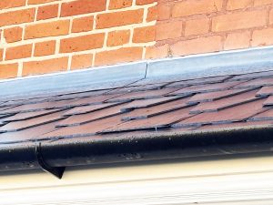 Traditional Welsh slate roof on door canopy