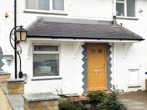 Door canopy installation in Muswell Hill with tiled roof