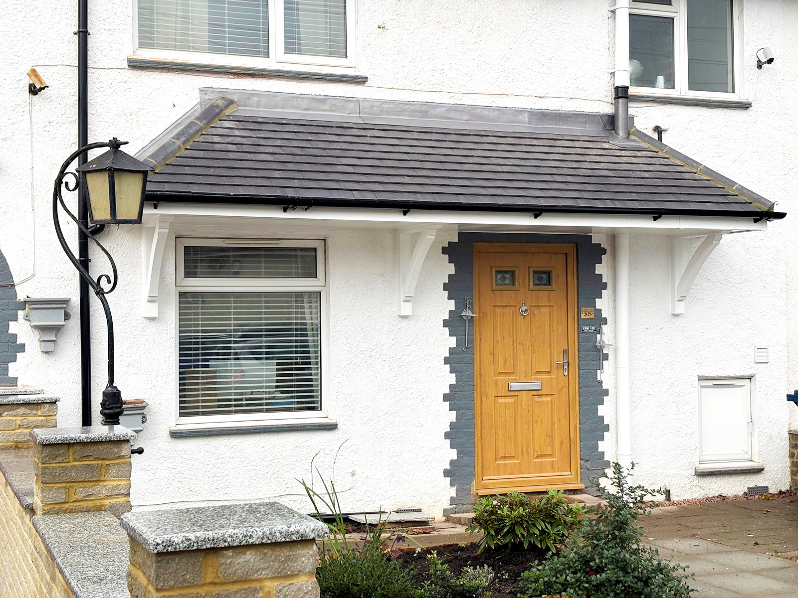 Door canopy installation in Muswell Hill with tiled roof